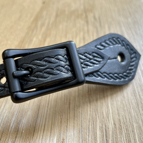Two S Leatherwork The Mamba Curved Body Rope Border Stamp Spur Straps with matte black center bar buckle.