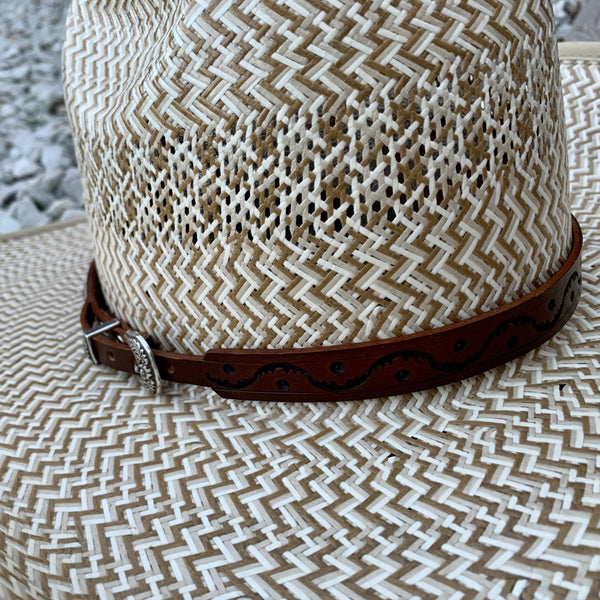 Two S Leatherwork Wave to the Crowd Hat Band close up on a straw hat.