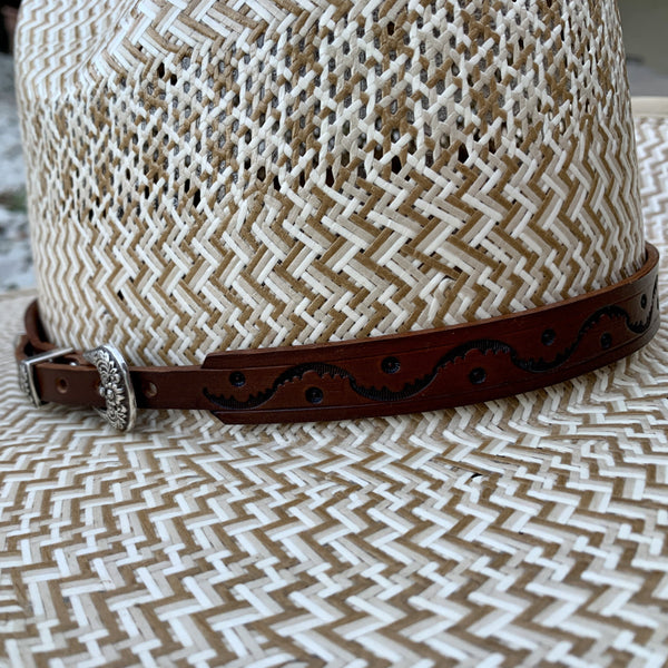 Two S Leatherwork Wave to the Crowd Hat Band close up on a straw hat.