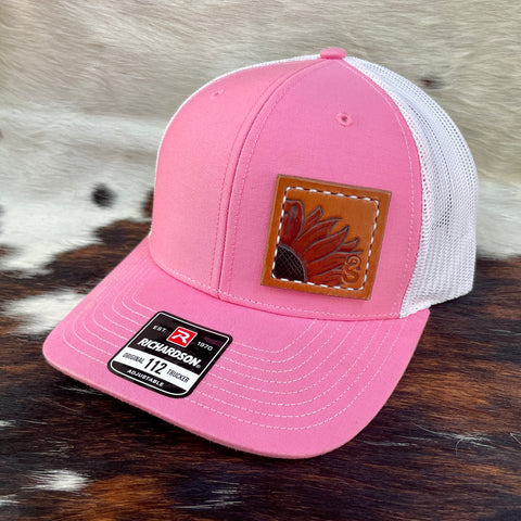 Pink/White Richardson 112 Trucker Hat with hand carved sunflower patch, hand dyed for color, and hand stitched. Front.