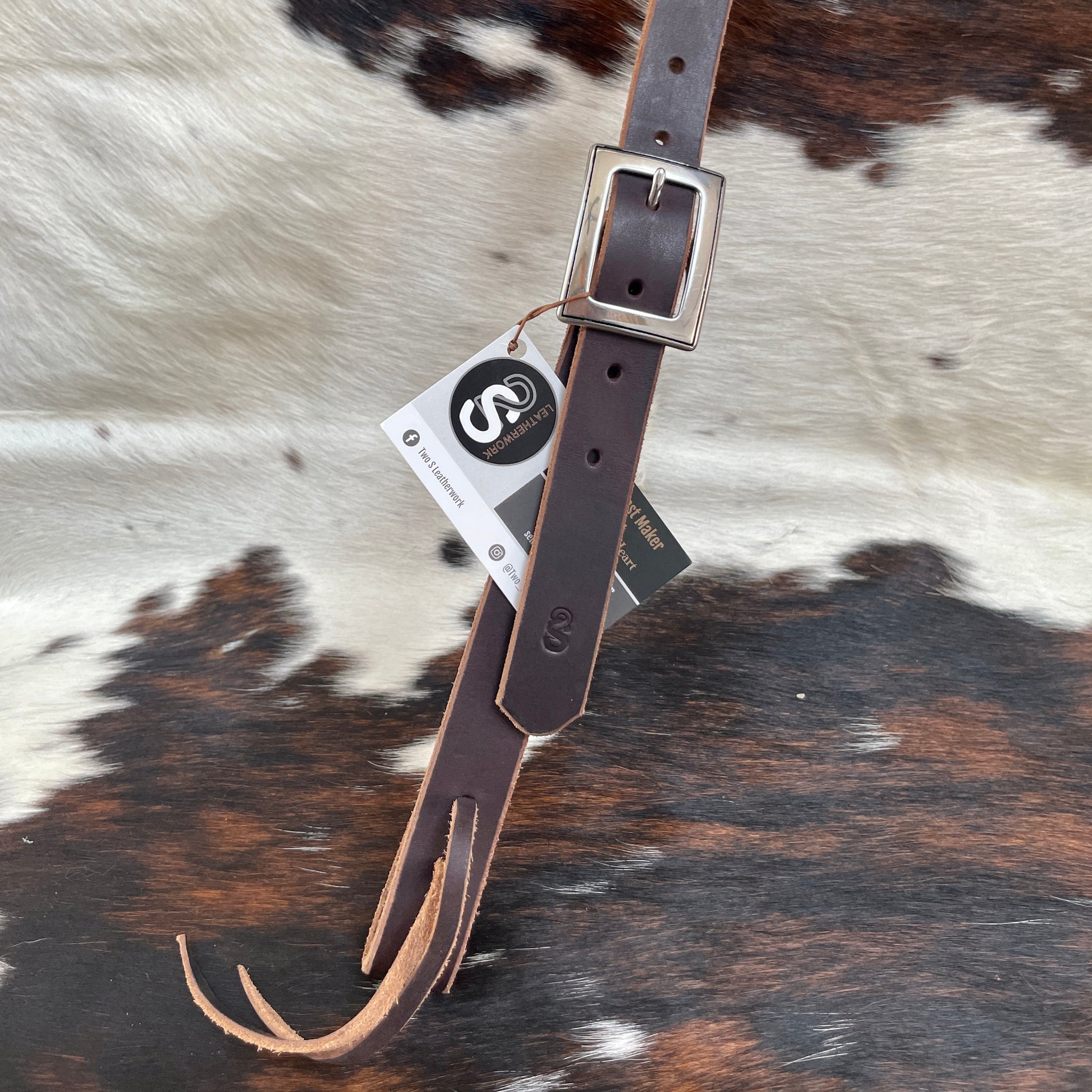 Functional and flashy slit ear working headstall made with latigo leather, Horse Shoe Brand by Jeremiah Watt hardware, and quick change lace. Buckle.